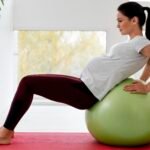 side-view-young-pregnant-woman-exercising-fitness-ball
